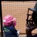 Natalie Harper watches the softball game on Saturday, May 4. Daniel Brenner I AnnArbor.com